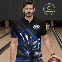 Load image into Gallery viewer, Male model in a bowling lane wearing black polo shirt, front view featuring blue flame bowling ball hitting pins with dynamic stripe graphics