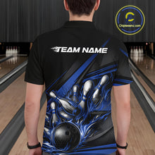 Load image into Gallery viewer, Male model at a bowling lane, back view of black polo shirt showcasing blue flame bowling ball and pins with abstract geometric accents