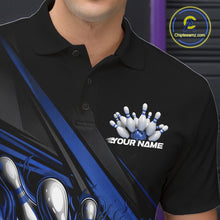Load image into Gallery viewer, Close-up left chest detail of black bowling polo shirt featuring blue flame bowling ball and pins emblem with geometric stripe artwork