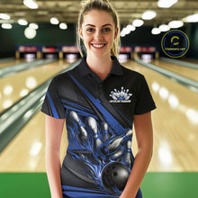 Load image into Gallery viewer, Female model in a bowling lane, front view wearing black polo shirt with blue flame bowling ball knocking down pins and abstract stripes