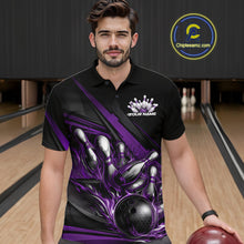 Load image into Gallery viewer, Male model in a bowling lane wearing a black polo shirt, front view featuring purple flame bowling ball hitting pins dynamic artwork
