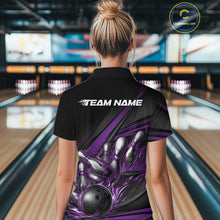 Load image into Gallery viewer, Female model at a bowling venue, back view of black polo shirt showcasing purple flame bowling ball and abstract stripe design