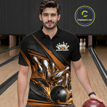 Load image into Gallery viewer, Male model in a bowling lane wearing a black polo shirt, front view featuring gold flame bowling ball hitting pins with dynamic stripe artwork