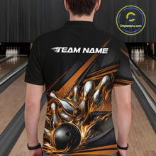 Load image into Gallery viewer, Male model at a bowling lane, back view of black polo shirt showcasing gold flame bowling ball and pins with abstract geometric design