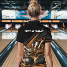 Load image into Gallery viewer, Back view of a female bowler wearing a black quarter-zip shirt, gold flame bowling strike artwork with geometric stripe accents.