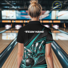 Load image into Gallery viewer, Female model at a bowling venue, back view of black polo shirt with turquoise flame bowling ball and abstract stripe graphics