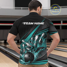 Load image into Gallery viewer, Male model in a bowling lane wearing a black quarter-zip shirt, turquoise flame bowling strike artwork with abstract striped sports graphics.