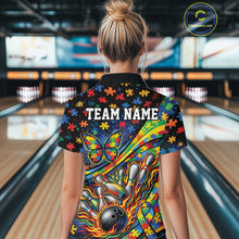 Load image into Gallery viewer, Back view of a female bowler wearing a colorful quarter-zip shirt, autism awareness design with ribbon, butterfly, and bowling-themed graphics.