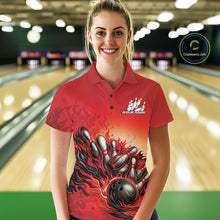 Load image into Gallery viewer, Female model wearing a red polo shirt in a bowling lane, front view featuring a flame bowling ball knocking down pins artwork
