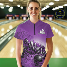 Load image into Gallery viewer, In a bowling lane, female model wearing a purple quarter-zip shirt, flame bowling ball striking pins with vibrant fire-inspired sports graphics.