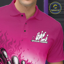 Load image into Gallery viewer, Close-up left chest detail of pink bowling polo shirt featuring flame bowling ball and pins emblem artwork