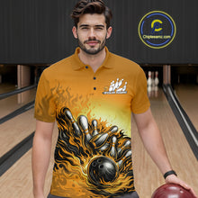 Load image into Gallery viewer, Male model in a bowling lane wearing a yellow polo shirt, front view featuring flame bowling ball knocking down pins artwork