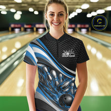 Load image into Gallery viewer, Front view female model wearing black and blue quarter zip bowling shirt in bowling lane, dynamic flame bowling ball and pins artwork
