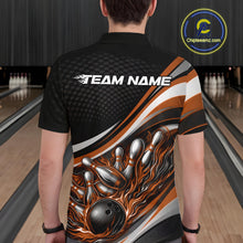 Load image into Gallery viewer, Back view of a male bowler wearing a black and orange polo shirt, flame bowling ball hitting pins with dynamic action artwork.