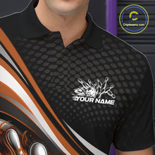 Load image into Gallery viewer, Close-up view of left chest area of a black and orange polo shirt, showing small flame bowling ball and pins graphic detail.