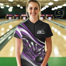 Load image into Gallery viewer, Front view female model wearing black and purple quarter zip bowling shirt in bowling lane, dynamic flame bowling ball and pins design