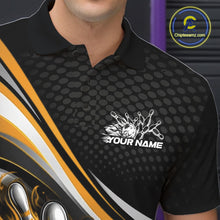 Load image into Gallery viewer, Close-up view of left chest area of a black and yellow polo shirt, showing small flame bowling ball and pins graphic detail.