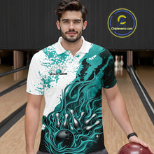 Load image into Gallery viewer, In bowling lane front view male model wearing bowling polo shirt, black base with turquoise blue and white flame bowling ball and pins artwork, dynamic sports lighting