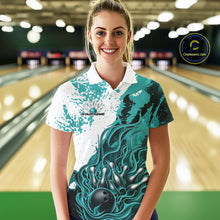 Load image into Gallery viewer, In bowling lane front view female model wearing bowling polo shirt, black turquoise blue and white scheme, flame bowling ball and pins artwork, dynamic sports lighting