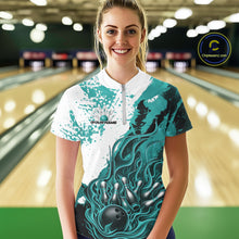 Load image into Gallery viewer, Front view of a female model in a bowling lane wearing a black quarter-zip shirt with turquoise blue and white flame bowling ball and pins design and dynamic sports graphics.