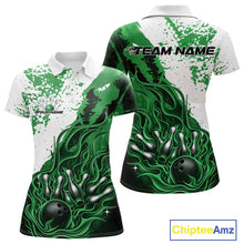 Load image into Gallery viewer, Front and back view womens bowling polo shirt mockup, black base with green and white accents, featuring flame bowling ball and pins artwork, studio product presentation