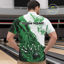 Load image into Gallery viewer, Front view of a male model in a bowling lane wearing a black quarter-zip shirt featuring black, green and white flame bowling ball and pins artwork with dynamic sports styling.