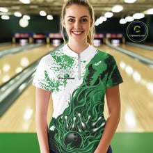Load image into Gallery viewer, Front view of a female model in a bowling lane wearing a black, green and white flame bowling quarter-zip shirt with energetic bowling action graphics.