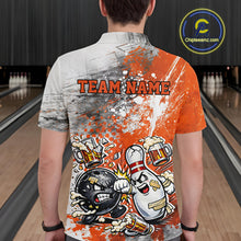 Load image into Gallery viewer, Back view of a male model in a bowling lane wearing an orange and white grunge splatter polo shirt featuring playful cartoon bowling action design.
