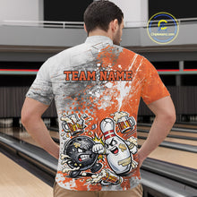 Load image into Gallery viewer, Front view of a male model in a bowling lane wearing an orange and white grunge splatter bowling quarter-zip shirt featuring playful bowling ball and pin fighting scene.