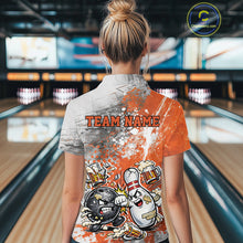 Load image into Gallery viewer, Back view of a female model in a bowling lane wearing an orange and white grunge splatter bowling quarter-zip shirt featuring playful cartoon bowling action illustration.