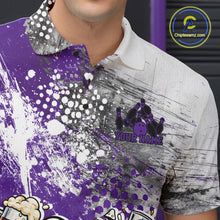 Load image into Gallery viewer, Close-up view of the left chest of a purple and white grunge splatter polo shirt showing humorous bowling ball and pin fist-fighting illustration detail.