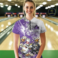 Load image into Gallery viewer, Front view of a female model in a bowling lane wearing a purple and white grunge splatter bowling quarter-zip shirt with humorous cartoon bowling ball and pin battling scene.
