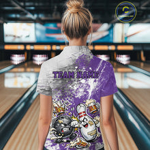 Load image into Gallery viewer, Back view of a female model in a bowling lane wearing a purple and white grunge splatter bowling quarter-zip shirt with a funny cartoon bowling ball and pin fist-fighting illustration.