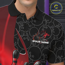Load image into Gallery viewer, Close-up view of the left chest of a black and red bowling polo shirt showing gradient bowling ball pattern with flaming strike artwork detail.
