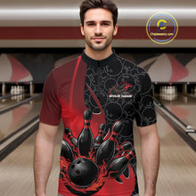 Load image into Gallery viewer, Male model in a bowling lane wearing black and red quarter zip shirt, front view featuring flaming black bowling ball striking pins dynamic sports artwork