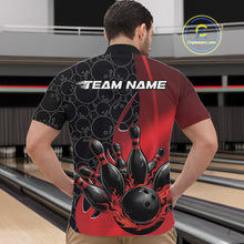 Load image into Gallery viewer, Male model in a bowling lane wearing black and red quarter zip shirt, front view featuring flaming black bowling ball striking pins dynamic sports artwork
