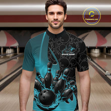 Load image into Gallery viewer, Male model front view at bowling lane wearing black and blue quarter zip shirt with fiery bowling ball graphic and pins impact scene