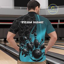 Load image into Gallery viewer, Male model in bowling alley front view wearing black and blue quarter zip shirt featuring flaming bowling ball striking pins with dynamic gradient design