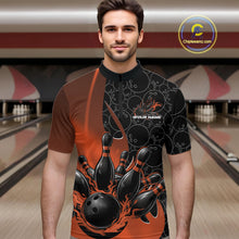 Load image into Gallery viewer, Male model front view at bowling lane wearing black and orange quarter zip shirt with flaming bowling ball design and energetic bowling strike graphics
