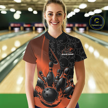 Load image into Gallery viewer, Female model in a bowling lane wearing black and orange quarter zip shirt, front view showcasing flaming bowling ball striking pins energetic design