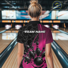 Load image into Gallery viewer, Female model at a bowling lane, back view of black and pink quarter zip shirt showcasing flaming bowling ball hitting pins with gradient accents
