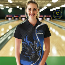 Load image into Gallery viewer, Female model front view in bowling venue wearing black and blue polo shirt with flaming bowling ball knocking down pins in energetic action scene.