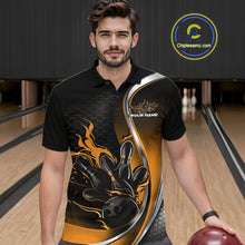 Load image into Gallery viewer, Male model seen from the front in a bowling lane wearing a black and yellow polo shirt featuring a flame bowling ball and pins design in a dynamic sports action scene.