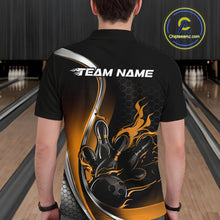 Load image into Gallery viewer, Male model seen from the back in a bowling lane wearing a black and yellow polo shirt featuring a flame bowling ball striking pins in a dynamic sports action design.