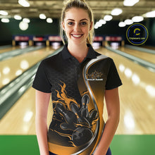 Load image into Gallery viewer, Female model front view in a bowling lane wearing a black and yellow polo shirt featuring flame bowling ball striking pins in a dynamic sports design.