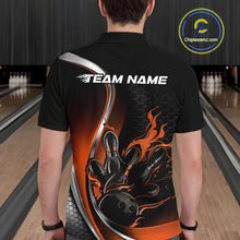 Load image into Gallery viewer, Male model seen from the back in a bowling lane wearing a black and orange polo shirt featuring a flame bowling ball and pins design in a dynamic sports illustration.