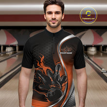 Load image into Gallery viewer, Male model front view in bowling alley wearing black and orange quarter zip shirt featuring flaming bowling ball striking pins dynamic artwork