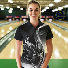 Load image into Gallery viewer, Female model front view in bowling lane wearing black and gray polo shirt with flaming bowling ball striking pins in energetic action scene.