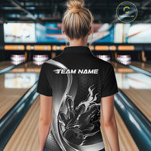 Load image into Gallery viewer, Female model back view inside bowling venue wearing black and gray quarter zip shirt with fiery bowling strike illustration