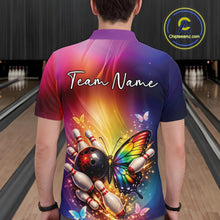 Load image into Gallery viewer, Back view of a male model in a bowling center wearing a bowling polo shirt showcasing a rainbow butterfly beside a bowling ball and pins.